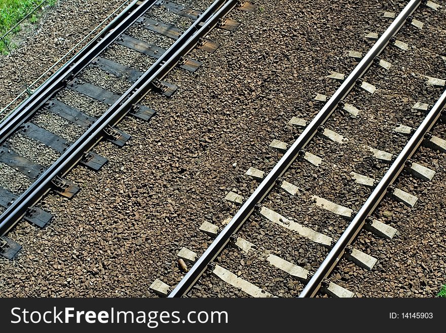 Old wooden and new concrete railroad tracks