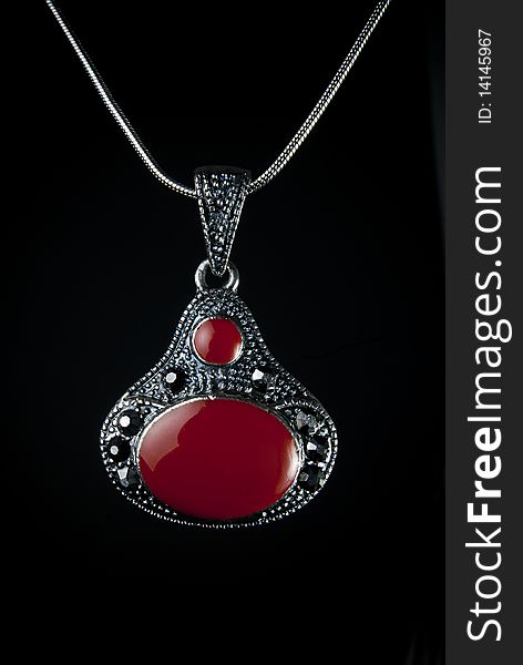 A pendent on a black background. A pendent on a black background