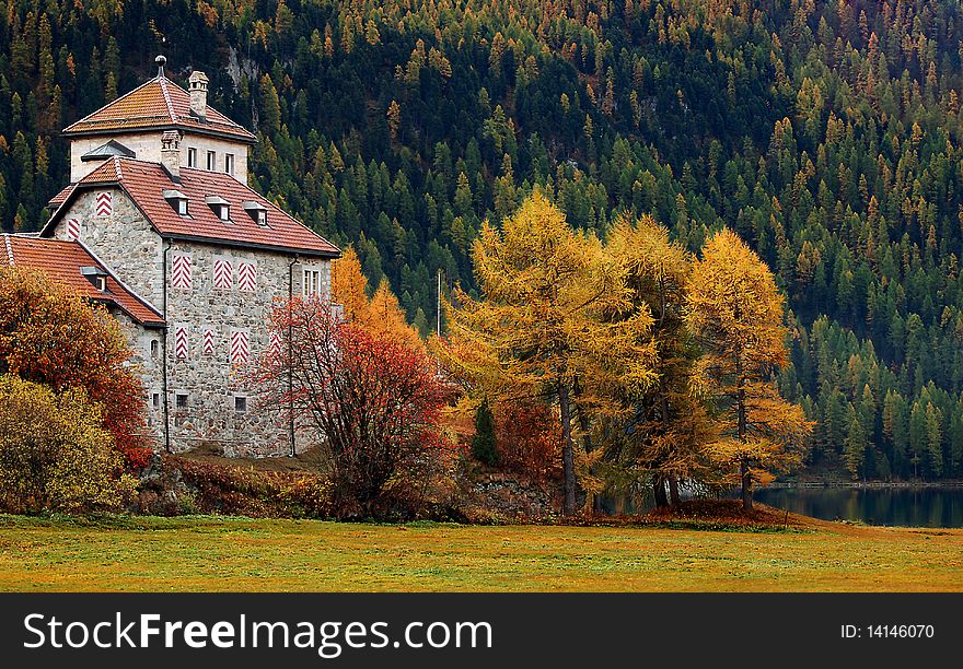 Autumn colors in Switzerland with the beautiful castle Crap da Sass in Engadin. Autumn colors in Switzerland with the beautiful castle Crap da Sass in Engadin