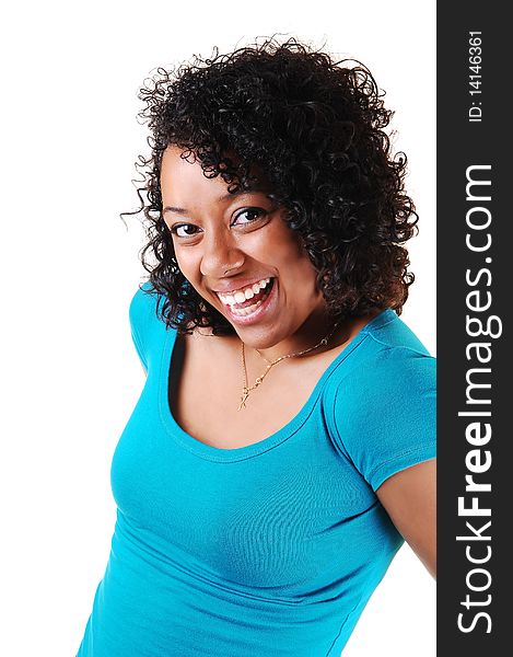 A portrait of a young Hispanic woman with curly black hair an blue top with a big smile on her face, standing in the studio for white background. A portrait of a young Hispanic woman with curly black hair an blue top with a big smile on her face, standing in the studio for white background.