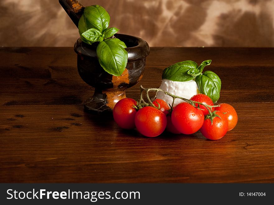 Photo of ricotta cheese with basil and tomatoes. Photo of ricotta cheese with basil and tomatoes