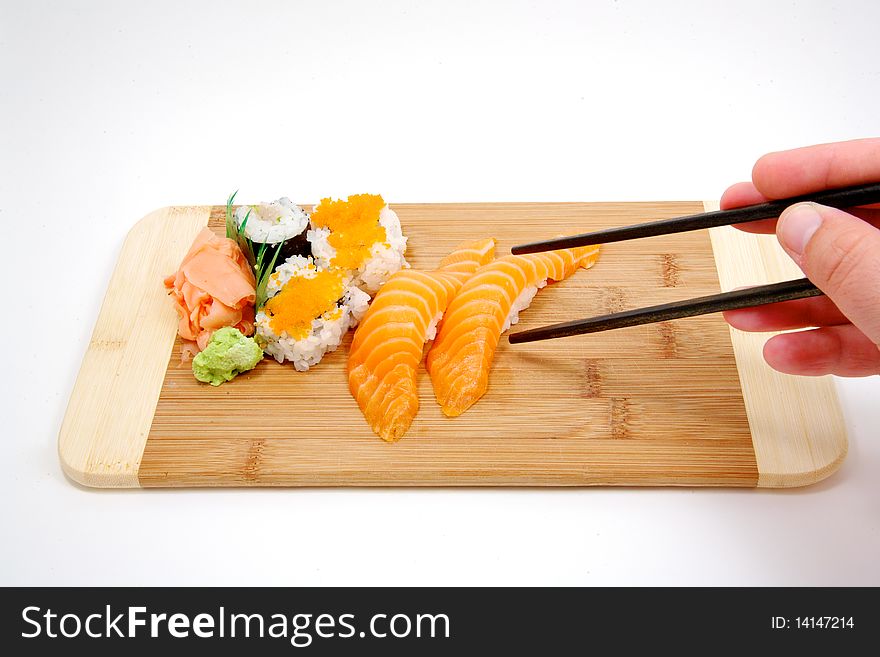 Trying To Pick Up Sushi With Chop Sticks