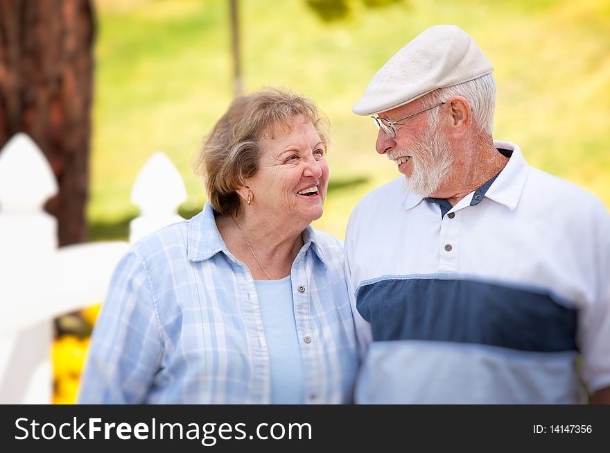 Happy Senior Couple In The Park