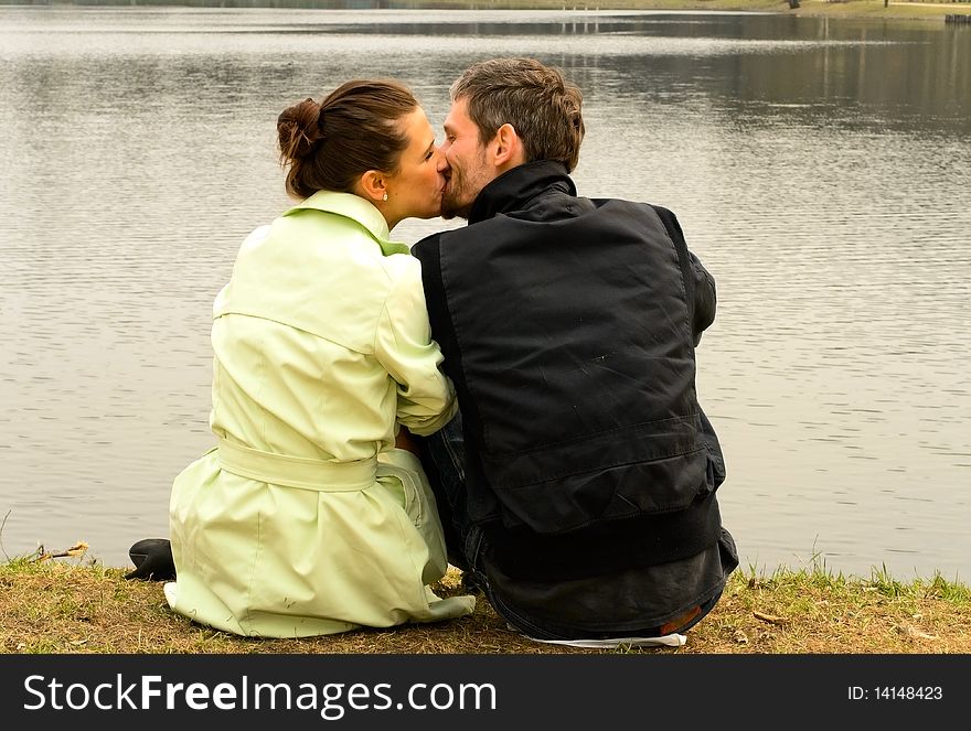 Young loving couple near the lake. Young loving couple near the lake
