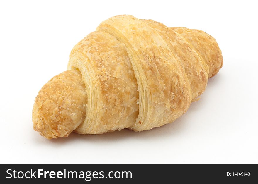 Small croissant isolated on white.