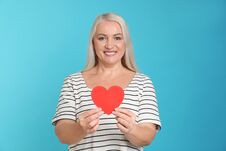 Free Portrait Of Mature Woman With Decorative Paper Heart Stock Images - 141417244