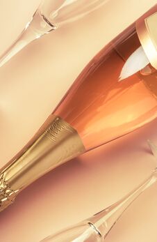 Bottle With Pink Sparkling Wine Or Rose Champagne And Two Glasses, Trendy Pink Background With Place For Text, Holiday Or Date Royalty Free Stock Images Bottle With Pink Sparkling Wine Or Rose Champagne And Two Glasses, Trendy Pink Background With Place For Text, Holiday Or Date Royalty Free Stock Images