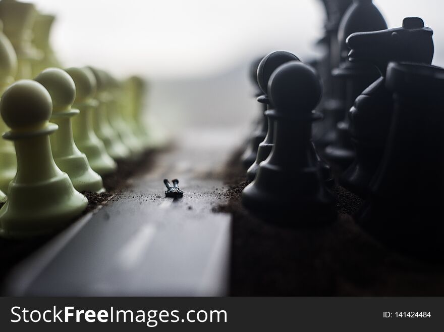 Chess board game concept of business ideas and competition and strategy ideas concep. Chess figures on a dark background with