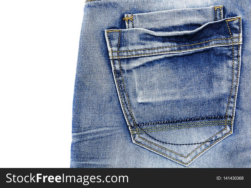 The texture of blue frayed jeans with a pocket on the isolate .Denim background
