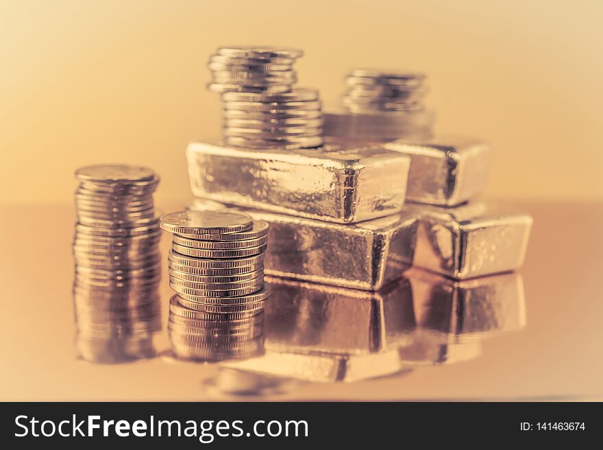 Gold bars and stack of gold coins. Background for finance banking concept. Trade in precious metals.