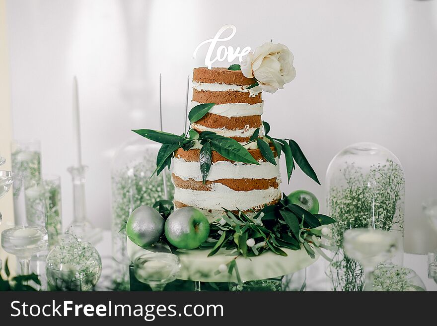 Engagement cake adorned with green leaves and apples. Engagement cake adorned with green leaves and apples