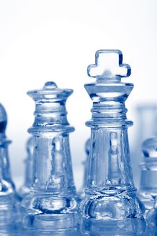 Glass Chess Pieces With Blue Light Royalty Free Stock Images