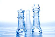 Glass Chess Pieces With Blue Light Stock Photos