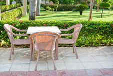 Brown Wooden Chairs An Tables On Patio Royalty Free Stock Images