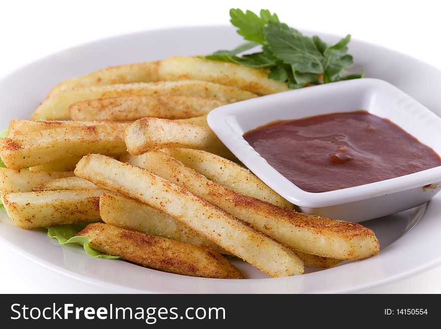 Fresh delicious French fries  with sauce on white plate