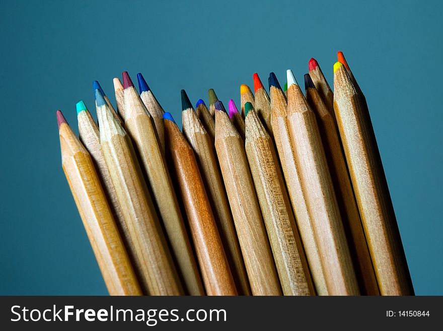 Disordered Pencils With Blue Background.