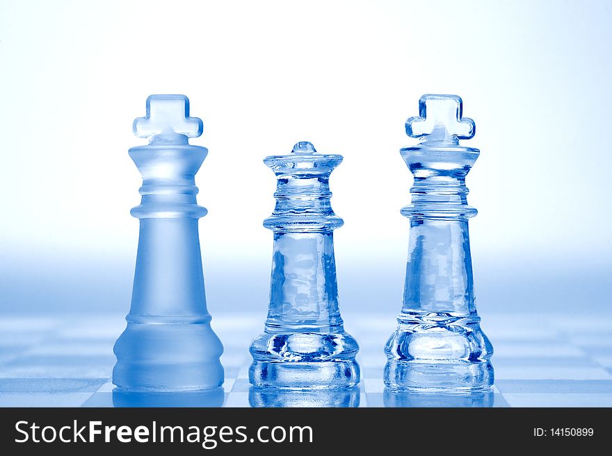 Glass chess pieces with blue light
