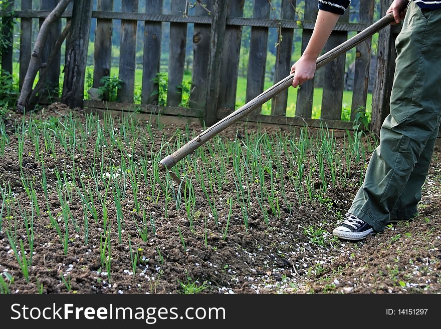 Girl Spading In The Garden