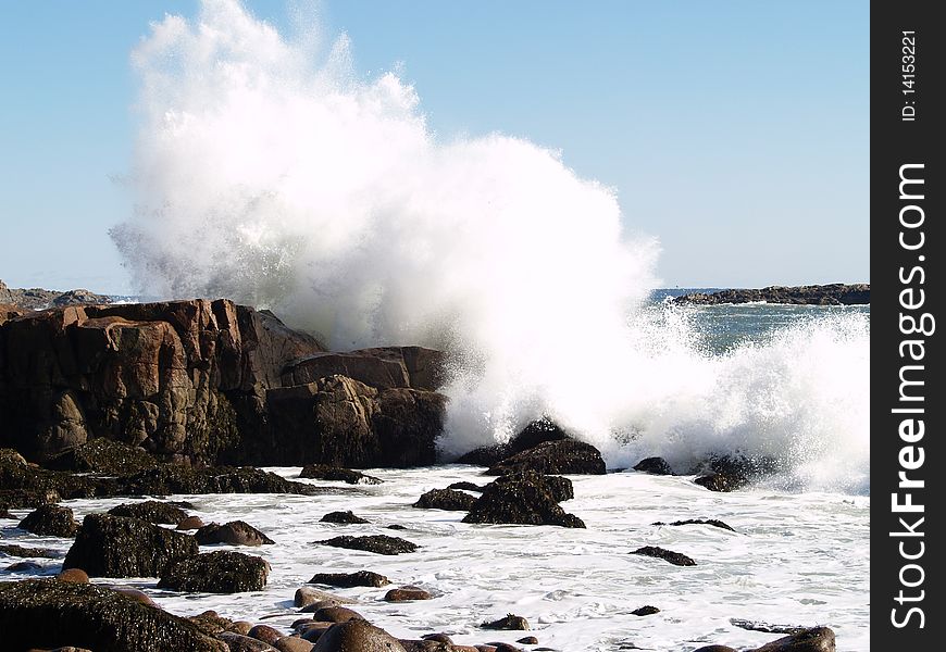 Heavy surf on rocks in New England. Heavy surf on rocks in New England