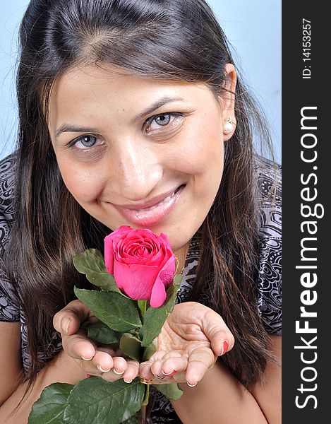 Smiling indian girl with rose flower. Smiling indian girl with rose flower.