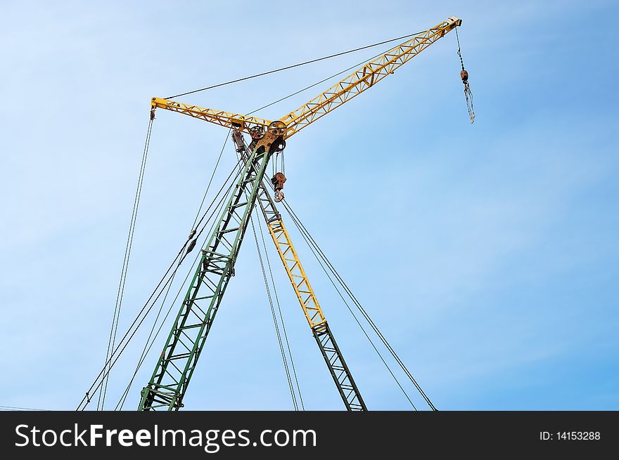 Crane on blue sky background can be easy isolated