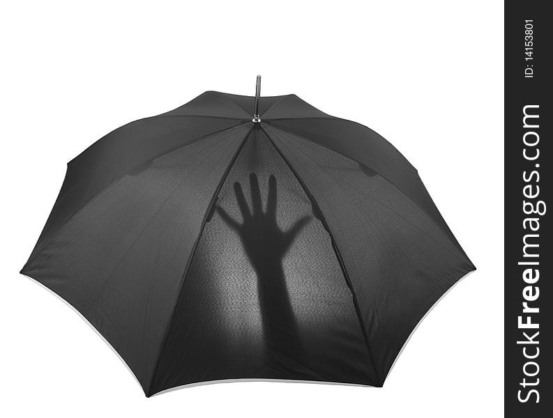 Black umbrella with hand silhouette against light
