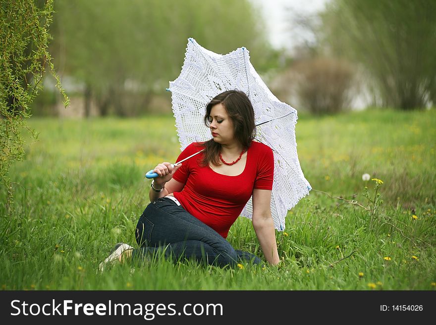 Girl with white umbrella in the meadow. Girl with white umbrella in the meadow