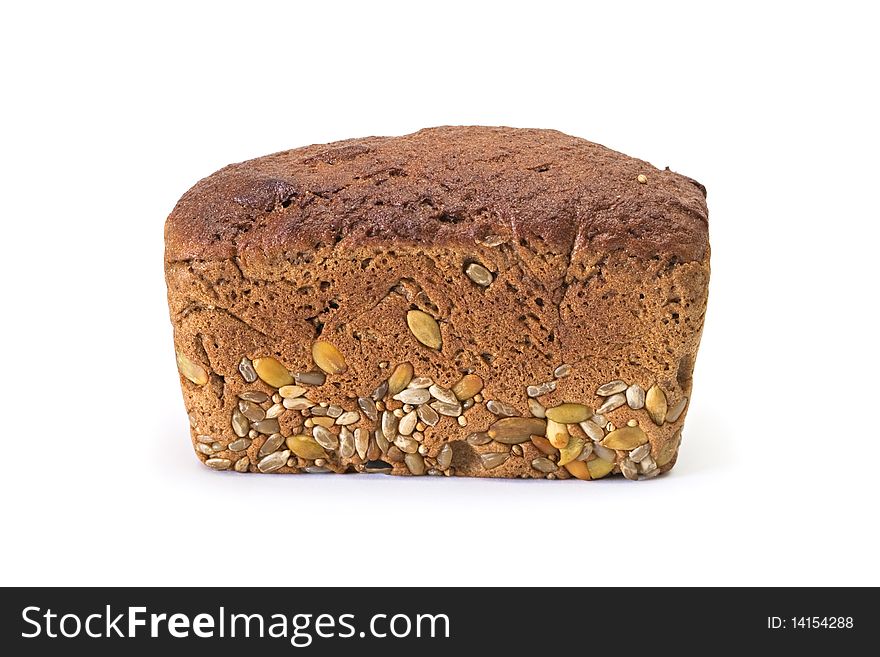 Whole brown bread with grain isolated on a white background. Whole brown bread with grain isolated on a white background.