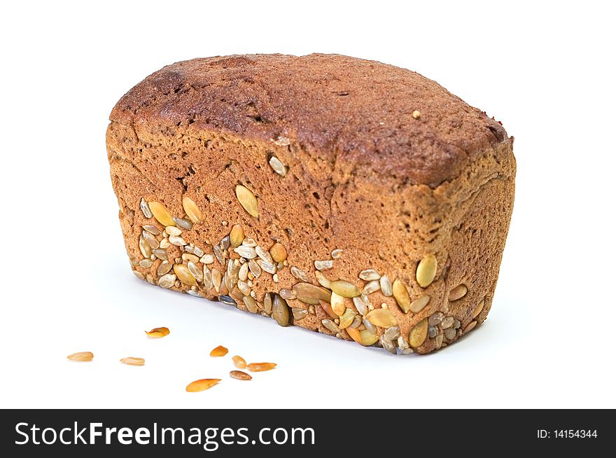 Whole brown bread with grain isolated on a white background. Whole brown bread with grain isolated on a white background.
