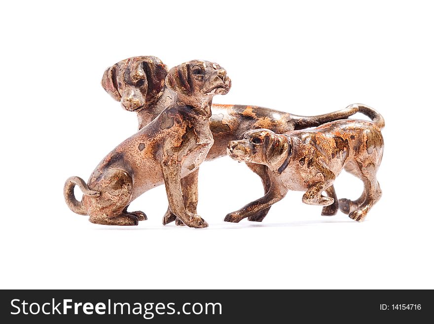 Three dogs of copper on a white background. Three dogs of copper on a white background