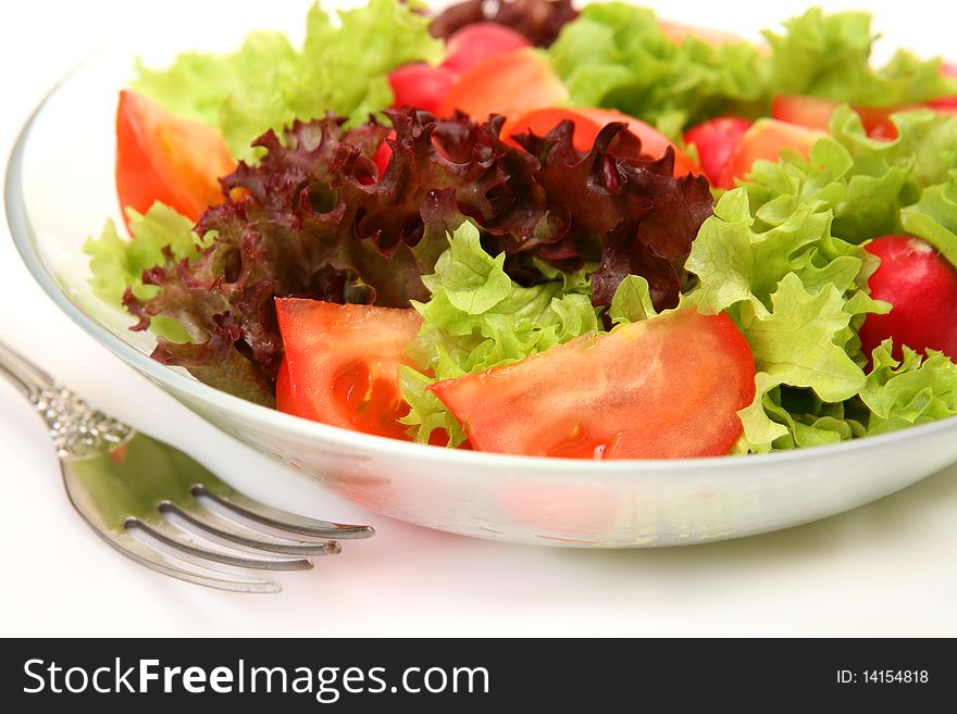 Salad from vegetables on a white background