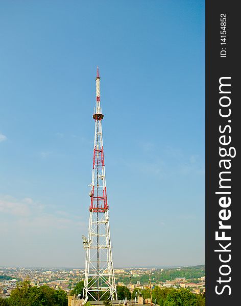 Communication tower over blue sky.