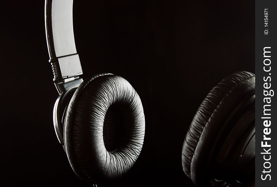 The low-key photo of a stereo headphones. The low-key photo of a stereo headphones