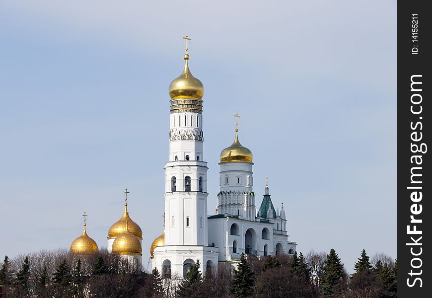 Photo of the Belltower of Ivan Great in Moscow because of the Kremlin wall. Photo of the Belltower of Ivan Great in Moscow because of the Kremlin wall.