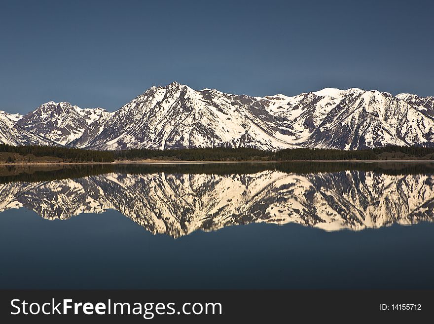 Reflection in the lac of the Grand Tetons in Wyoming