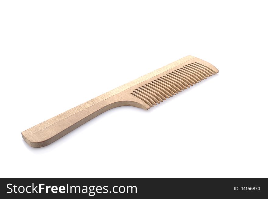 Wooden comb, isolated white background