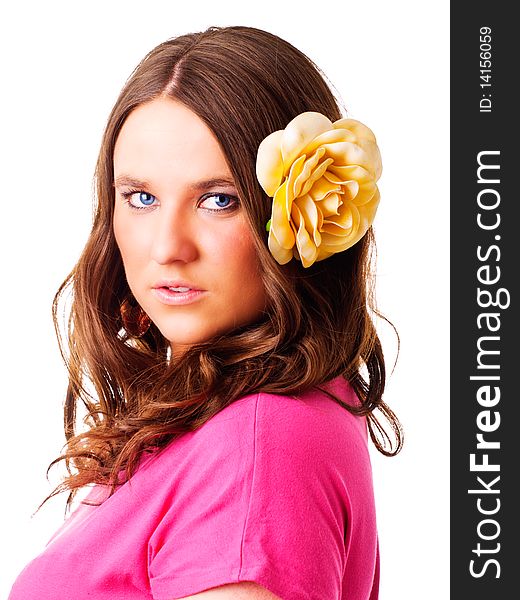 Girl with flower in hair over white