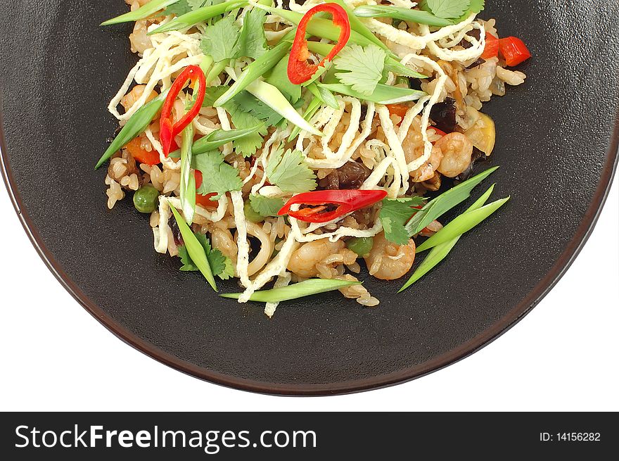 Salad with shrimps on plate on a white background