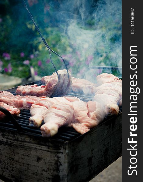 Image of chicken legs being grilled. Image of chicken legs being grilled.