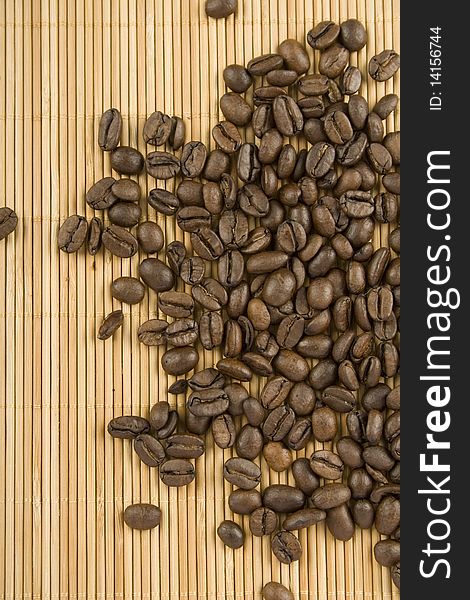 Coffee beans. Lie on a wooden surface. Top view