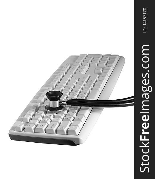 The keyboard is listened by means of a phonendoscope on a white background close up isolated. The keyboard is listened by means of a phonendoscope on a white background close up isolated