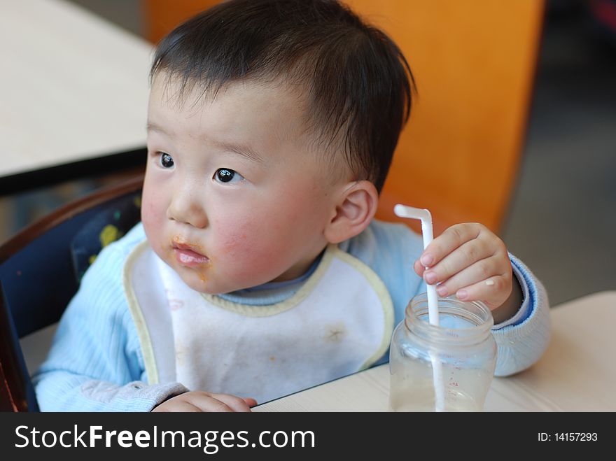 Asian little baby drink water at lunch time