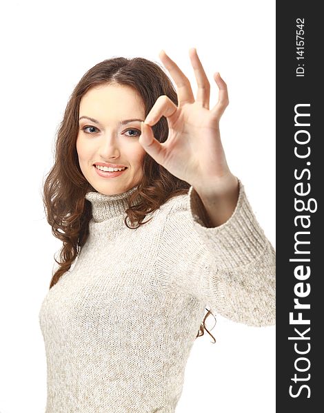 Beautiful young woman indicating ok sign, isolated on white.