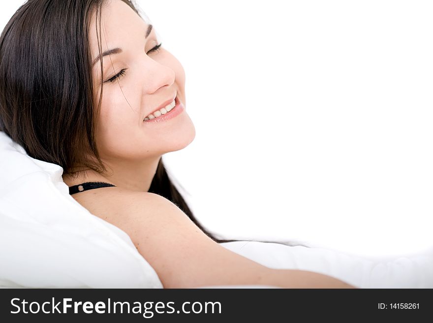 Young attractive brunette woman lying in bed. Young attractive brunette woman lying in bed