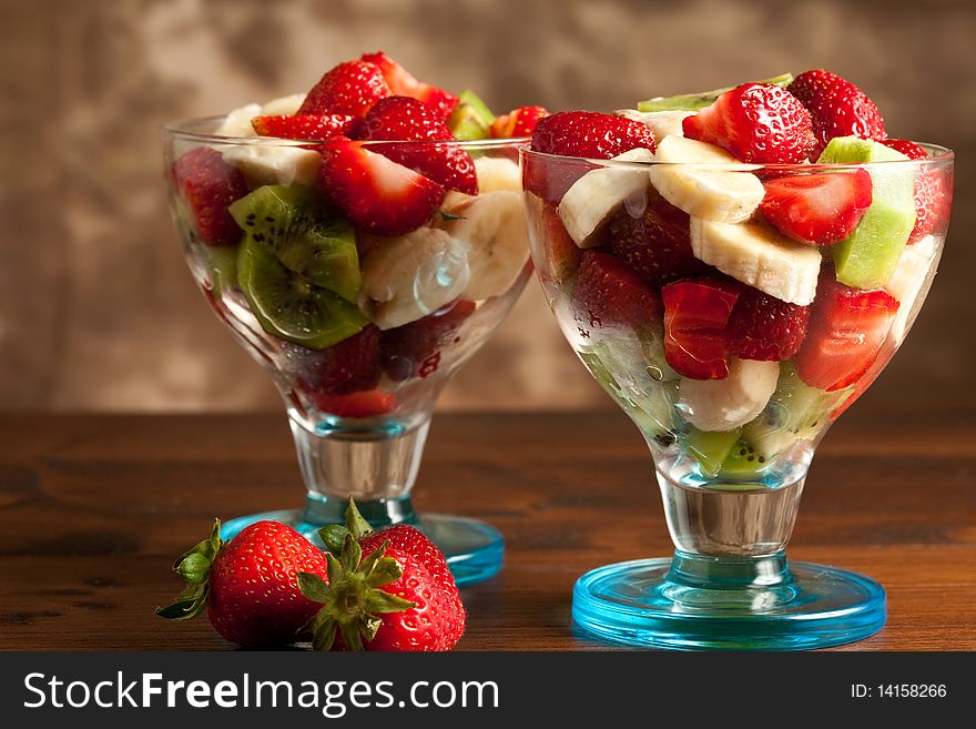 Photo of tasty fruitsalad in calix with strawberries. Photo of tasty fruitsalad in calix with strawberries