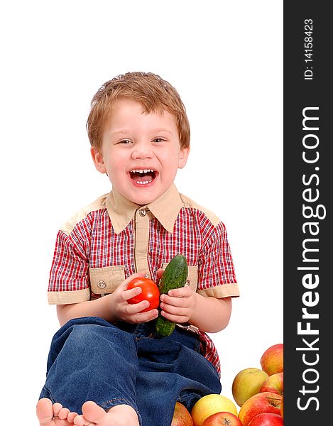 The little boy with fruit and vegetables isolated on white background