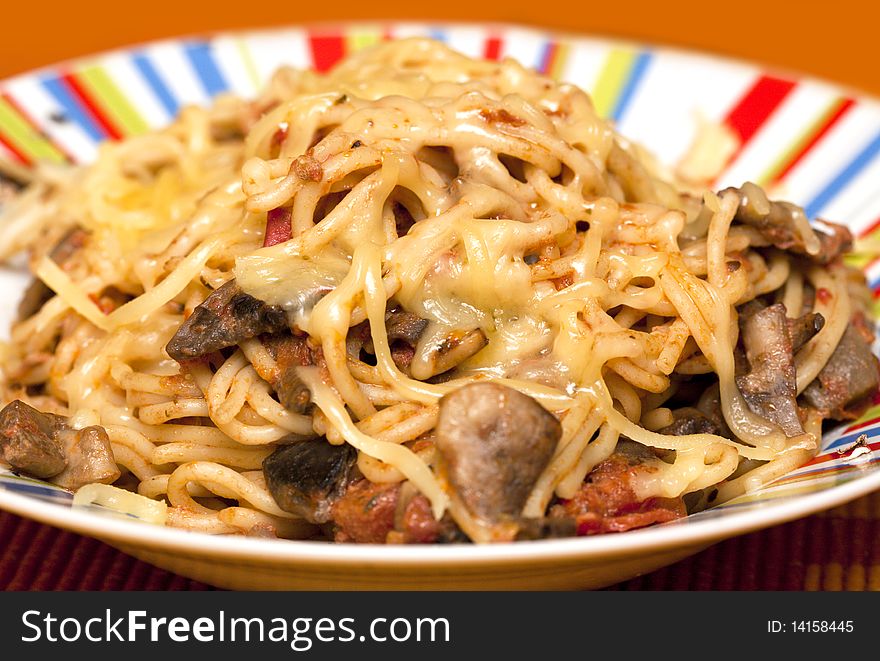 Spaghetti bologna with mushrooms in a plate