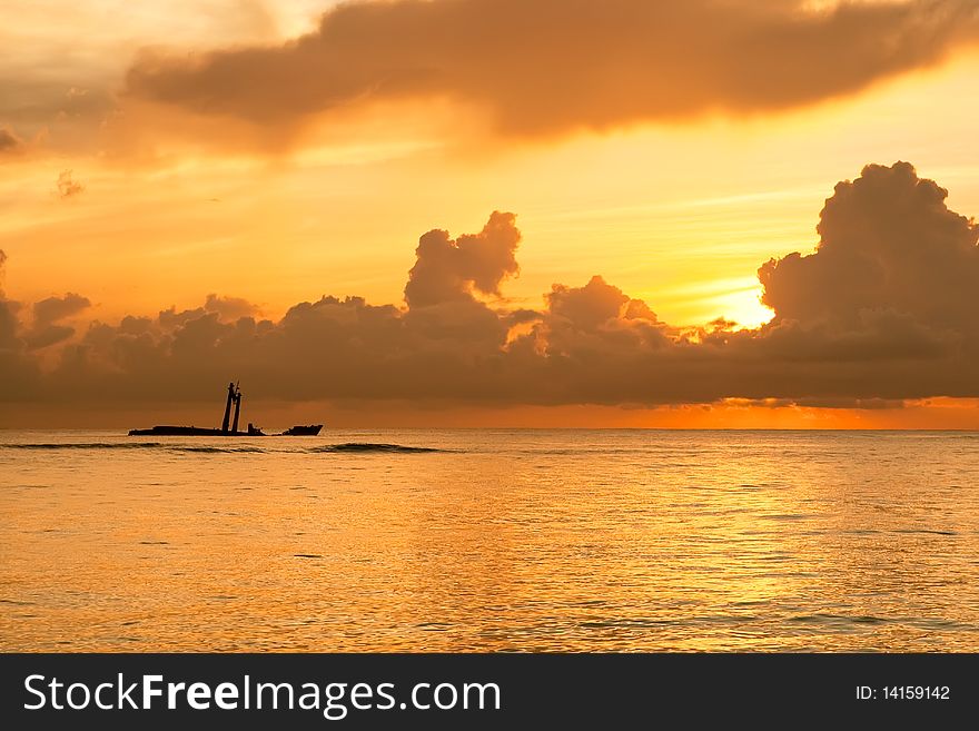 Bright sunrise in early morning with sand beach and ocean in summer. Bright sunrise in early morning with sand beach and ocean in summer