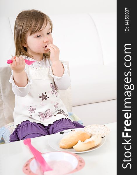 Sweet toddler little girl eating