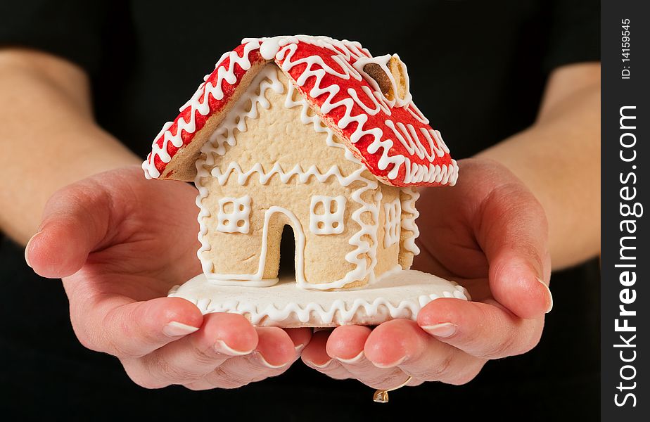 Nice color gingerbread house in the hand